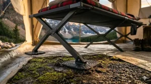 Large swivel feet of a heavy-duty camping cot 500 lbs to prevent sinking into soft Canadian terrain.