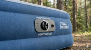 A 3D cutaway diagram displaying the internal coils and durable multi-layer PVC structure of a built-in pump air mattress for camping.