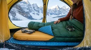 Illustration of layering a foam pad under an inflatable mattress for four-season Canadian camping.