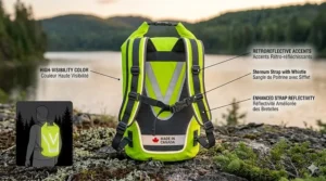 Brightly colored 30L dry bag for canoe camping, visible against forest terrain.