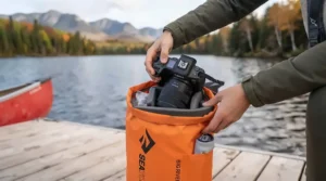 A comfortable neoprene camera strap worn crossbody while paddling a canoe.