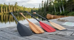 Selection of lightweight canoe paddles displayed together to highlight different material options for Canadian lake paddling.