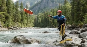 Paddlers navigating cold Canadian spring water while carrying a dependable throw bag for canoe rescue.