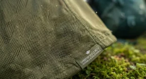 Durable and breathable fabric details of a mosquito jacket for camping during humid Canadian summer weather.