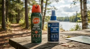 Close-up of insect repellent spray bottles highlighting active ingredients for Canadian outdoor activities.